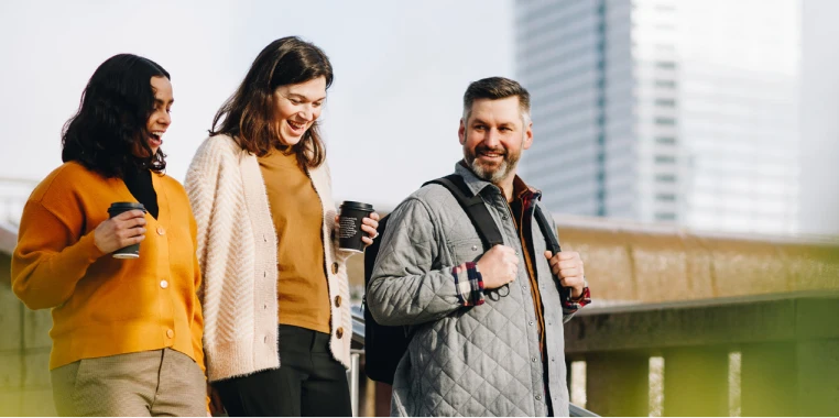 People drinking coffee, walking, and socializing in a lively, eco-friendly setting. People drinking coffee, walking, and socializing in a lively, eco-friendly setting.